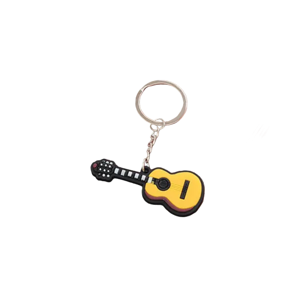 Guitar-shaped keychain on a wooden display box with red fabric lining