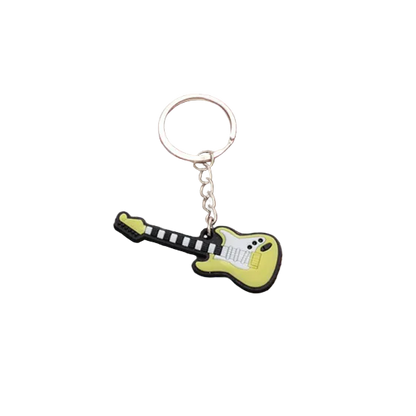 Guitar-shaped keychain on a red and white checkered board with a wooden border