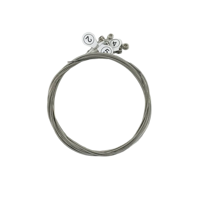 Set of guitar strings with tuners on a light gray background